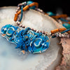 fashion statement necklace made of clay, sea sediment jasper, golden sponge coral, fresh water pearls, and chrysocolla.