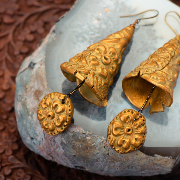 handmade earrings made of clay, glass beads, and hematite.