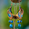 3 inch handmade drop earrings made of clay, fresh water pearls and lapis.