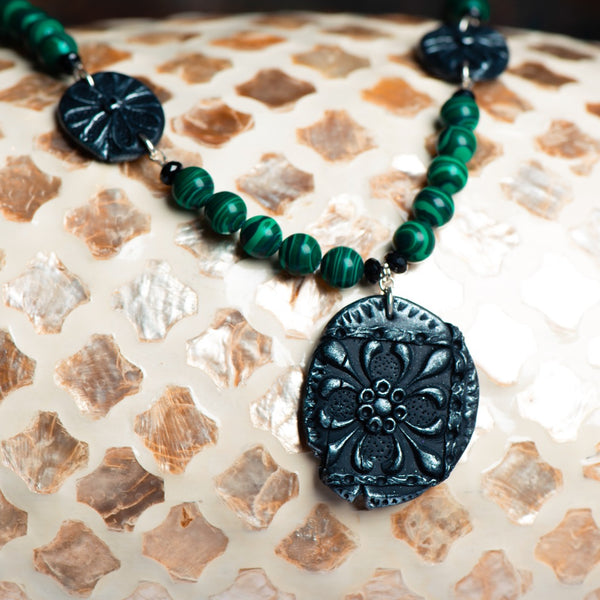 Fashion statement necklace made of clay, malachite and spinal.