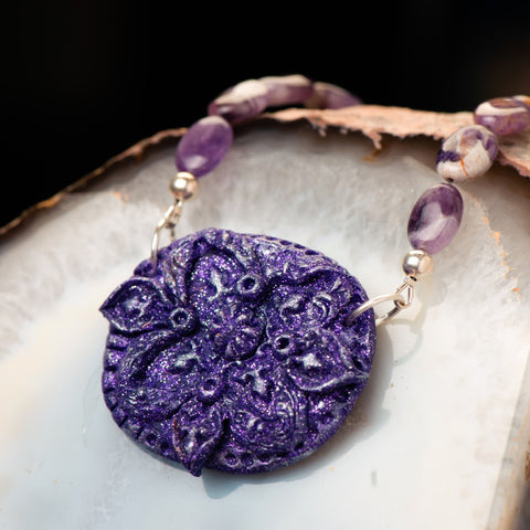 fashion statement necklace made of clay, amethyst, and sterling silver beads. 