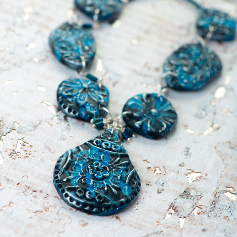 Fashion statement necklace made of clay and chrysocolla.