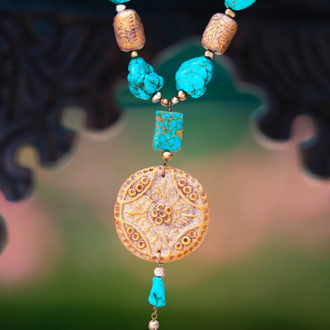 Fashion statement necklace made of clay, turquoise and fresh water pearls.