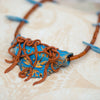 statement necklace made of polymer clay, coral, and kyanite.